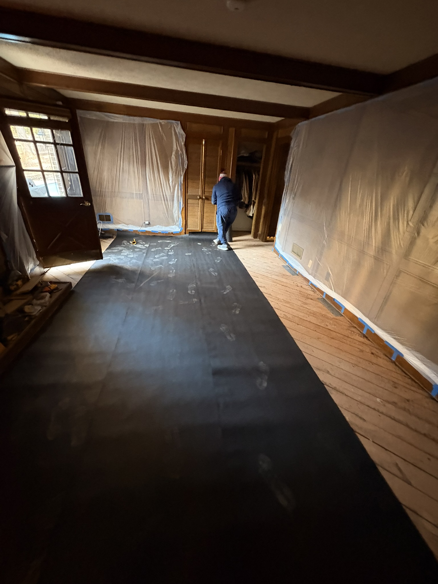 laying felt paper over subfloors