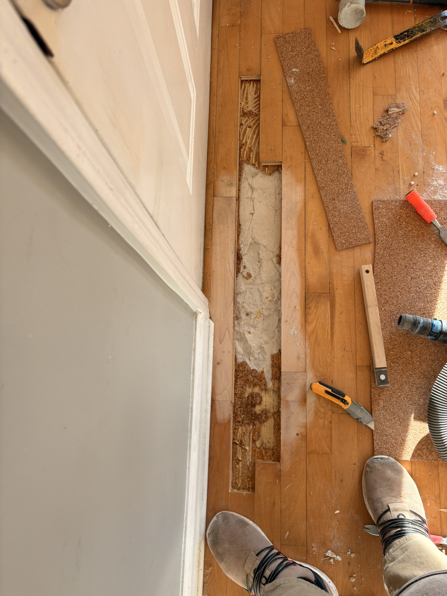 damaged floor by the door